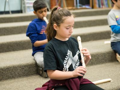 child playing recorder
