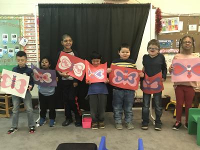 students hold valentines
